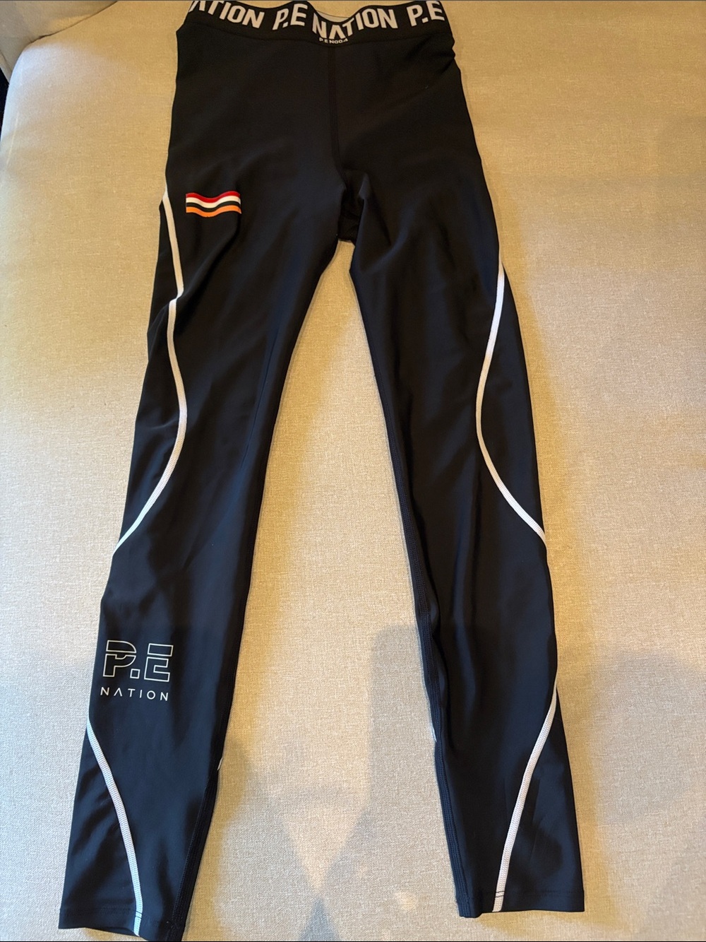 P.E Nation Black Leggings with White Piping and Red Accent